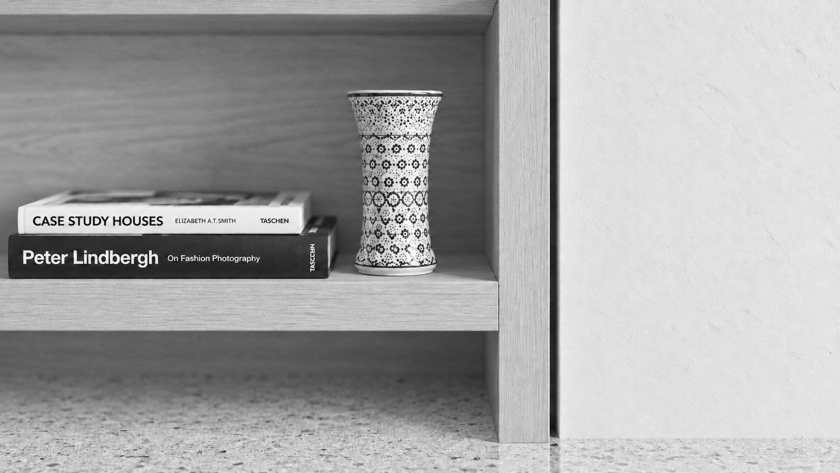 Oak shelving with vase and terrazzo in a West Vancouver residence by Joanna Smolinski Interior Design